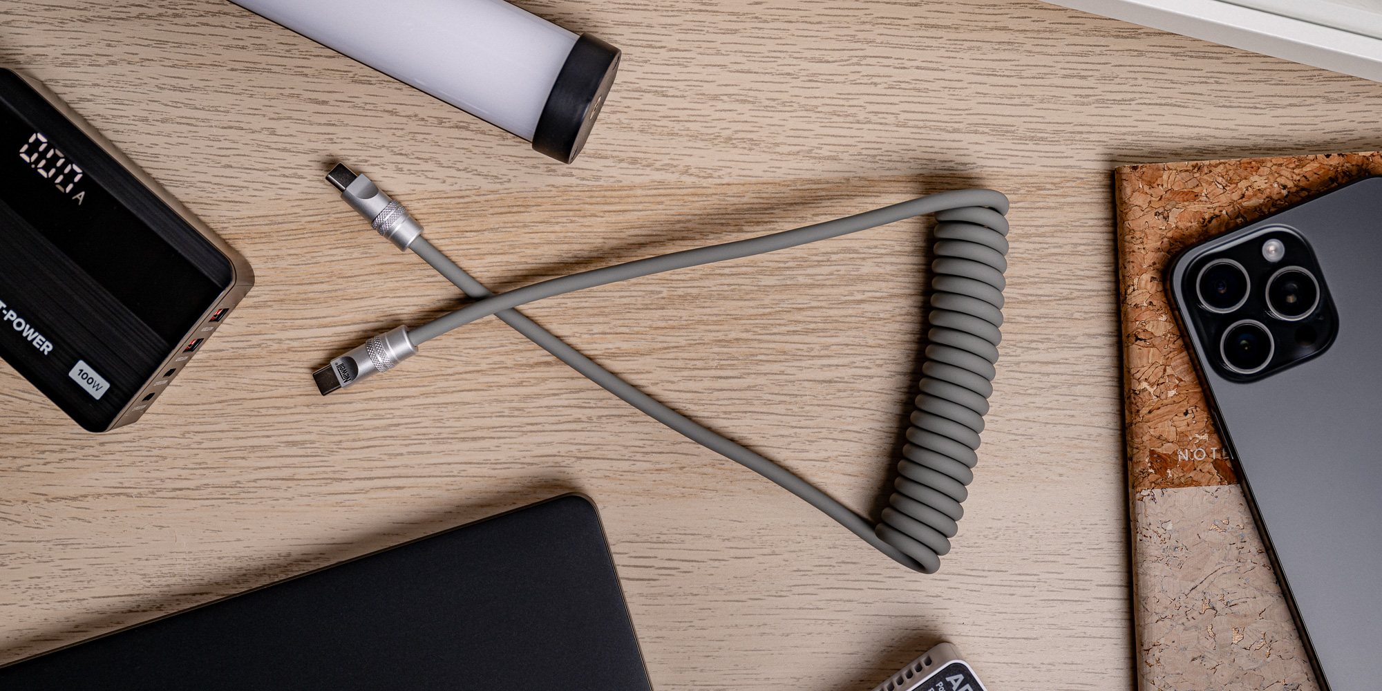 Kabel Newell USB-C - USB-C 100 W, 1,5 m, silikonowy, spiralny, szary